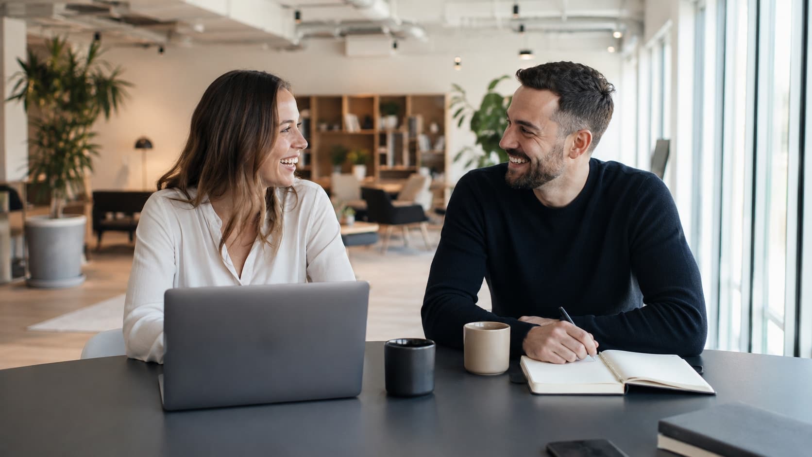 Business partners shaking hands in a meeting at the office